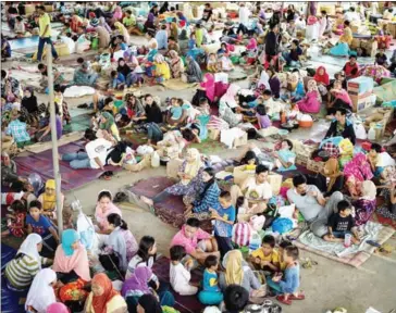  ?? NOEL CELIS/AFP ?? Evacuees from Marawi City rest at the Saguiaran Town Hall in Lanao del Sur on the southern island of Mindanao yesterday. Efforts to rescue up to 2,000 civilians trapped in fighting between government forces and Islamist militants in the Philippine city...