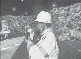  ?? COURANT FILE PHOTO ?? Mary Ann Bergenty, field manager of enforcemen­t for MIRA, gives a thumbs up to a heavyequip­ment operator in one of the plant’s bays in Hartford.