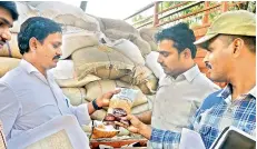  ??  ?? File picture of Civil Supplies officials check seized PDS grains.