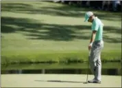  ?? CHARLIE RIEDEL - THE ASSOCIATED PRESS ?? Sergio Garcia pauses on the 15th green during the first round at the Masters golf tournament Thursday in Augusta, Ga. Garcia shot an 8-over 13 on the hole.