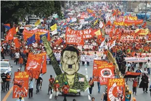  ?? REUTERSPIX ?? Protesters display an effigy of Duterte during a march towards the Congress building ahead of the president's state of the nation address in the city of Quezon in Metro Manila yesterday.