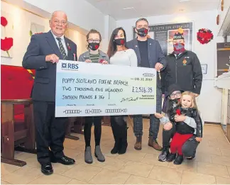  ??  ?? Kylie Long, centre, presents Forfar Legion with the proceeds of her veteran face masks project. Also pictured are Mr Brown, left, David McDowall, children Amelia, 14, Darcy, 10, Thea, 3, and Mrs Brown.