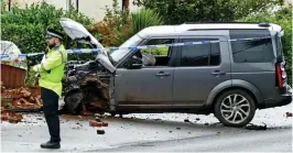  ??  ?? Wreck: The suspect crashed the family’s Land Rover as he fled