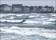  ??  ?? POUNDING: These homes look out on rough seas at Ardrossan.