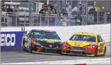  ?? Steve Helber / Associated Press ?? Joey Logano, right, and Martin Truex Jr. make contact as they approach the finish line at Martinsvil­le Speedway on Sunday.