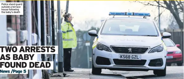  ??  ?? Police stand guard outside a terrace house following the baby’s death