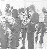  ?? Picture: SUPPLIED ?? Gary Mitchell (2nd from right) speaks with Rakiraki residents.