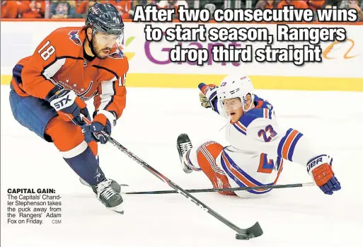  ?? CSM ?? CAPITAL GAIN: The Capitals’ Chandler Stephenson takes the puck away from the Rangers’ Adam Fox on Friday.