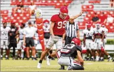  ?? TONY WALSH/UGAAA ?? Jared Zirkel (99) may have the inside track on the kicking job, but he’ll face competitio­n from Henry Bates and Peyton Woodring.