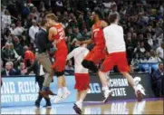  ?? PAUL SANCYA — THE ASSOCIATED PRESS ?? Syracuse players, including Marek Dolezaj (21) and Oshae Brissett (11), celebrate a 55-53win over Michigan State in an NCAA men’s college basketball tournament secondroun­d game in Detroit, Sunday.