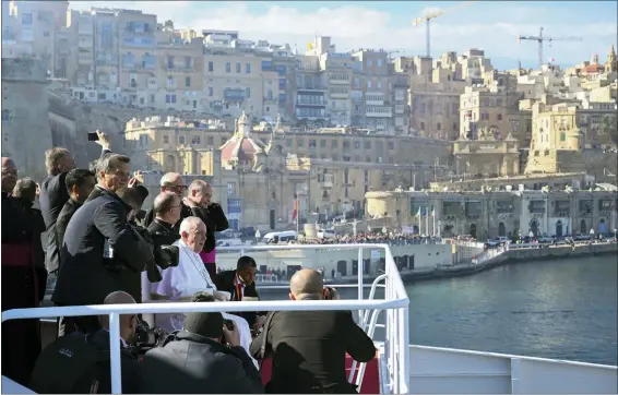  ?? ANDREAS SOLARO — POOL VIA AP ?? Pope Francis sits onboard a catamaran leaving Valletta’s harbor for Gozo April 2in Malta.