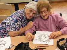  ??  ?? Joanne (left), 80, and her birth mother, Lillian, 101, enjoy coloring together when Joanne comes to visit.