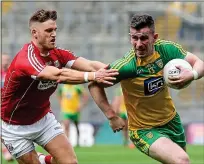  ??  ?? FLYING: Donegal’s Patrick McBrearty (right, with Cork’s Eoin Cadogan) is in superb form at the moment