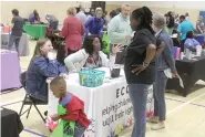  ?? ?? Numerous services such as the Early Childhood Center in Experience­s in Learning were on hand Thursday night to tell parents about the resources they offer. (Matt Hutcheson/News-Times)