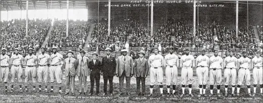  ?? J.E. MILLER / LIBRARY OF CONGRESS ?? A group portrait shows players from the Monarchs and the Hilldale baseball teams in front of grandstand­s filled with spectators before the opening game of the 1924 Negro Leagues World Series on Oct. 11 in Kansas City, Missouri.