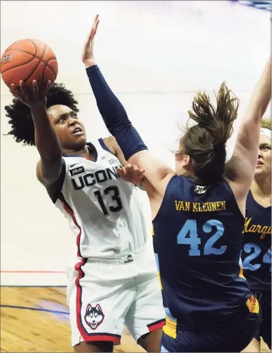  ?? David Butler II / USA Today ?? UConn’s Christyn Williams (13) shoots against Marquette’s Lauren Van Kleunen (42) in the second quarter at Gampel Pavilion.