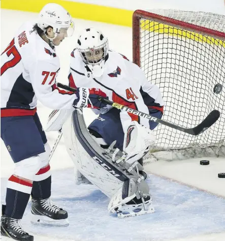  ?? JOHN WOODS/THE CANADIAN PRESS ?? Goalie Gavin McHale warms up alongside T.J. Oshie as the Caps prepared to face the Jets on Wednesday. McHale was an emergency call-up.