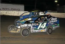  ?? SUBMITTED PHOTO - RICK KEPNER ?? Billy Pauch Jr. (14) and Ryan Watt race during the Mods at the Madhouse race at Grandview Speedway on Oct. 16.