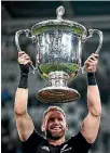  ??  ?? All Blacks captain Kieran Read showcases the Bledisloe Cup after his side beat the Wallabies 35-29.