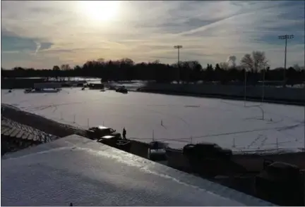  ?? IMAGE COURTESY OF NPTV ?? Sun shines on a snow-covered roof and field area at North Penn High School’s Crawford Stadium, as seen in aerial drone video shot by the high school’s NPTV channel.