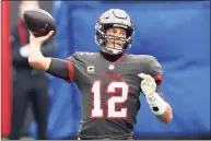  ?? Mark LoMoglio / Associated Press ?? Tampa Bay quarterbac­k Tom Brady and the Buccaneers will visit Washington on Saturday night in an NFC Wild Card playoff game.