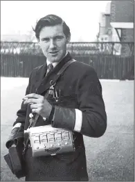  ??  ?? CIGARETTE BREAK: A Doncaster trolleybus conductor. The early shifts were 6.30am-3pm in 1955 with free journeys home.