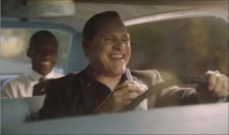  ??  ?? UNIVERSAL PICTURES Viggo Mortensen’s Tony Lip, foreground, and Mahershala Ali’s Dr. Don Shirley share a laugh in a scene from “Green Book.”