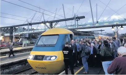  ??  ?? Interest
Train enthusiast­s who were at Stirling Station to say `goodbye’to the Inter-City 125