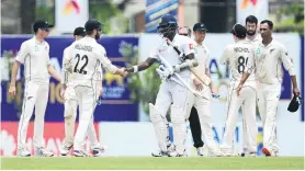  ?? PHOTO: GETTY IMAGES ?? Well played . . . New Zealand captain Kane Williamson congratula­tes Sri Lankan batsman Angelo Mathews after Sri Lanka clinched victory in the first test at Galle Internatio­nal Stadium yesterday.