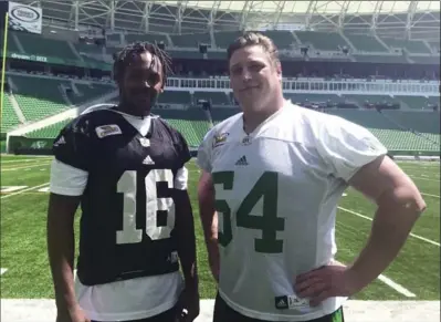  ?? DREW EDWARDS, THE HAMILTON SPECTATOR ?? Former Ticats Bakari Grant, left, and Peter Dyakowski are in Regina, where a new $278-million stadium was just opened on time and on budget.