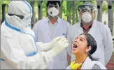  ?? DEEPAK GUPTA/HT PHOTO ?? A medical worker taking swab sample of a girl at Indira Nagar community centre, Lucknow, on Tuesday.