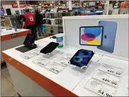  ?? AP PHOTO/DAVID ZALUBOWSKI ?? Apple ipads are displayed in a Costco warehouse Sunday, March 17, 2024, in Sheridan, Colo. On Wednesday, April 10, 2024, the Labor Department issues its report on inflation at the consumer level in March.