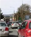  ??  ?? Traffic outside Holy Family NS Tubbercurr­y. Pic: Tom Callanan