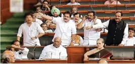  ?? PTI/ TV grab ?? Congress leader Jyotiradit­ya Scindia and other members shout in the Lok Sabha during the Monsoon session of Parliament on Tuesday