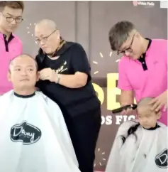  ??  ?? Ling and his son have their head shaved for a good cause.