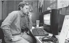  ?? Staff file photo ?? Longtime reporter and editor Mike Snyder, seen working from home in 1998, retired Friday after 40 years at the Chronicle.