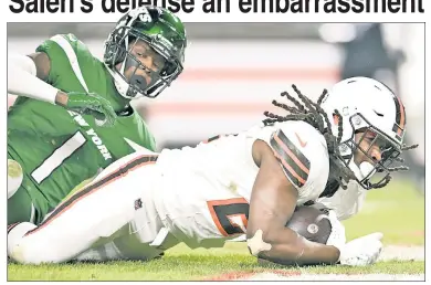  ?? Getty Images ?? WEAK SAUCE: Jets cornerback Sauce Gardner can’t keep Cleveland’s Kareem Hunt out of the end zone on Thursday night as Gang Green’s defense was battered by the Browns’ attack.