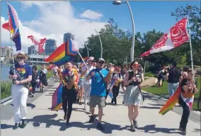  ?? Daily Courier ?? RON SEYMOUR/The
The Pride March in Kelowna on Saturday had purpose, vision, and passion — everything a new city-backed festival planned for August lacks, reporter Ron Seymour says.