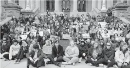  ?? PAUL SANCYA AP ?? Current and former Michigan State University students rally at the capitol in Lansing, Mich., on Wednesday, two days after Alexandria Verner, Brian Fraser and Arielle Anderson were killed after a gunman opened fire on the campus of Michigan State University. Five other students remained in critical condition as of Wednesday afternoon.