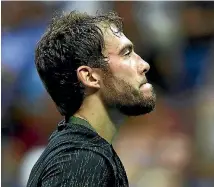  ??  ?? Jerzy Janowicz, left, of Poland was gutted to lose to Novak Djokovic, right, at the US Open in New York yesterday.