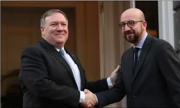  ?? AP Photo/FrAncIsco seco ?? U.S. Secretary of State Mike Pompeo (left) is greeted by Belgian Prime Minister Charles Michel prior to a meeting in Brussels, on Tuesday.