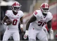  ?? JULIO CORTEZ — THE ASSOCIATED PRESS ?? Indiana offensive lineman Matthew Bedford, right, blocks for quarterbac­k Donaven Mcculley against Maryland on Oct. 20 in College Park, Md.