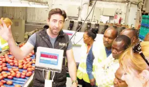  ??  ?? Keogh’s Crisps director, Ross Keogh explains the process of making crisps to a Kenyan delegation during their tour in the firm in Dublin. The company currently makes crisps for the niche market that include the Emirates Airlines. PHOTO | MICHAEL ORIEDO | NMG