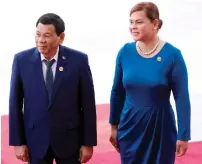  ?? AFP ?? duterte and his wife Honeylet Avancena arrive for the opening of the Boao Forum for Asia Annual conference 2018 in Boao, south china’s Hainan province, on Tuesday. —