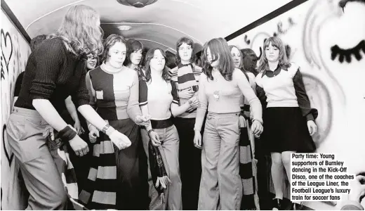  ??  ?? Party time: Young supporters of Burnley dancing in the Kick-Off Disco, one of the coaches of the League Liner, the Football League’s luxury train for soccer fans