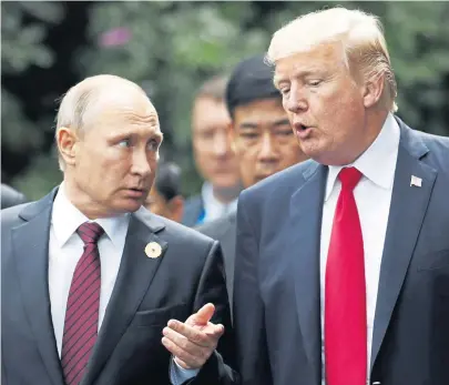  ?? JORGE SILVA / POOL REUTERS ?? GETTING TOUGH: U.S. President Trump, at right in 2017 photo with Russian President Vladimir Putin, announced he is withdrawin­g from the Intermedia­te-Range Nuclear Forces Treaty with Russia.