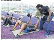  ??  ?? The Gleaner’s Fit 4 Life fitness coach Marvin Gordon instructin­g participan­ts how to properly use weights.