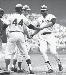  ?? Associated Press 1969 ?? Willie McCovey (right) is congratula­ted by Hank Aaron (44) during the 1969 AllStar Game. McCovey wore 44 because he idolized Aaron and they shared the same Alabama hometown.