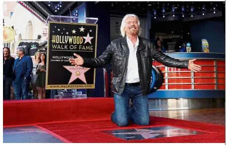  ?? — Reuters ?? Stamp of approval: Branson posing by his star after it was unveiled on the Hollywood Walk of Fame in Los Angeles.