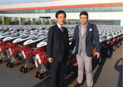  ??  ?? Asia Tech Managing Director Jae-Won Uhm and FIT Corea’s Philip Kim pose before thousands of small cultivator­s at Asia Tech’s stockyard.